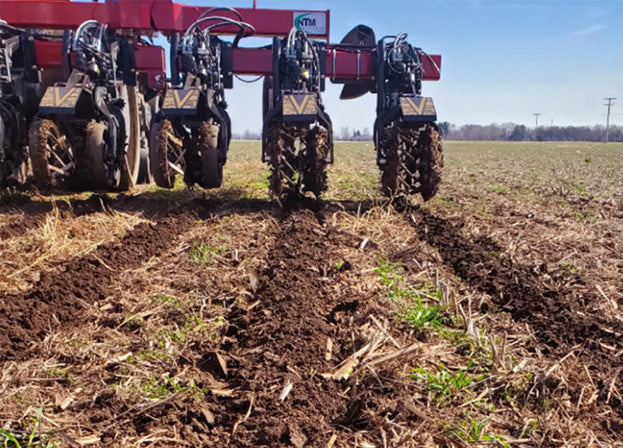 Dawn Pluribus working in the field